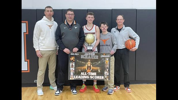 Jackson Schauer ... center with Coaches Travis Grueb, Kelly Daughters, Doug Schauer and Derik Trainor. Photo courtesy Amie Schauer