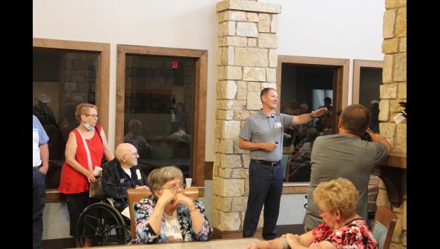Jeremy Schultes introduced the board of directors and thanked everyone for coming to the open house and touring this beautiful addition to Philip Health Services, The Scotchman Living Center.