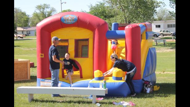Two inflatables were set up for kids to have fun crawling around in, and sliding down during the fundraiser. Caysen Fromm is seen here making an exit from the smaller play zone.