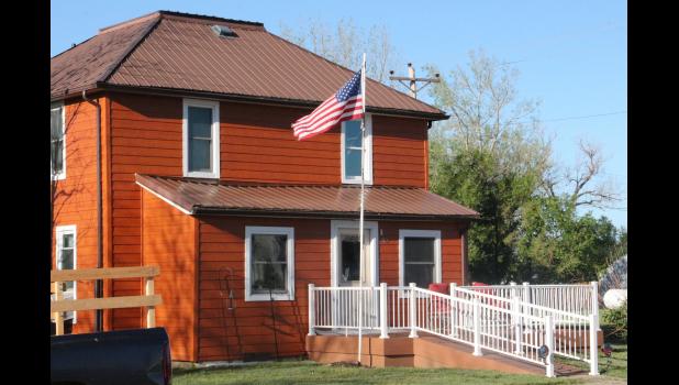 In all the chaos residents of Philip were facing the morning after the storm Saturday, the house of Phil and Cheryl Pearson looked untouched and very peaceful with the United States flag blowing in the breeze.