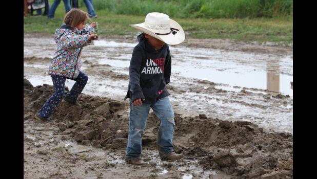 Kids were having fun in the mud, during the Philip Matched Bronc Ride, Saturday. With two plus inches of rain on Saturday the event went on and kids got muddy.