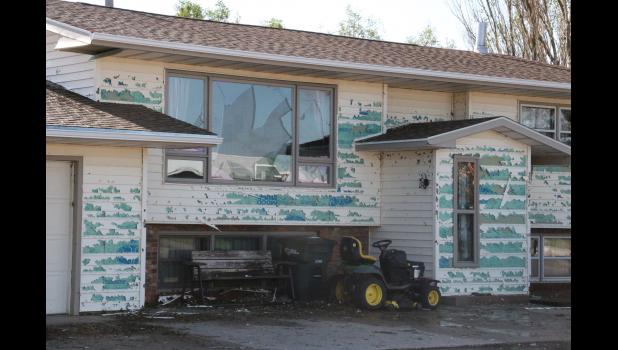 Bob and Mona VanLint received broken windows with huge siding damage to the west side of their home along Highway 73 through Philip.