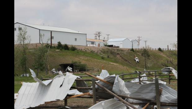Strong Sunday evening winds caught a building on the east side of Scotchman Industries and took the entire east side roof off, blowing Southwest through an arena along Hone St. Some of the roofing tin and wood ending up in the trailer home park on Valley Dr.