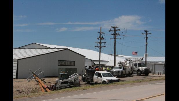 Electric Companies from four different Co-ops are in the area working on projects, here they are working on a down pole at Scotchman Industries on Highway 14 in Philip.