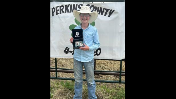 Remi Hauser with her Jr Jr Barrel Racing Buckle.