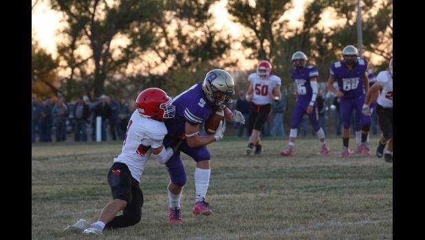 Rylee Veal (9) keeps his feet moving as he heads for the end zone in the win over Chester. Photo by Sarah Martian