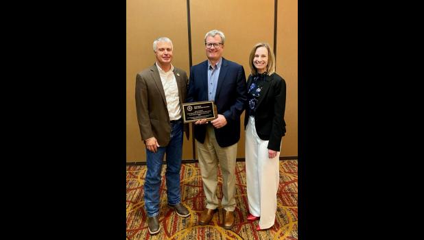 Shane Penfield (center), the 2023 Prosecutor of the Year, is pictured with South Dakota Attorney General Marty Jackley and Alexis Tracy, current Clay County State’s Attorney and State’s Attorneys Association board president.
