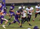 Longhorns … working their way around Dupree blockers to tackle ball carrier #32 at Friday nights game against the Dupree Tigers. Faith won 18-12. Photo courtesy Tanya Bushong