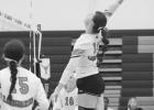 Reagan Grueb ... soaring above the net, to send the ball into Newell territory courtesy of setter Skylar Vig. The Longhorns won over the Newell Irrigators in their last home game of the regular season. Photo courtesy Alison Grueb
