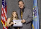 Ethney Simmons representing Bison High School with Governor John Rhoden.