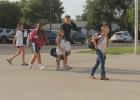 Palmer Simons; Ethany, Evie & Elum Simmons; Macarty Rice make their way to the front door to begin a new school year.