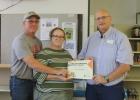 Charley and Lisa Harpster receive the award from Michael Steffen.
