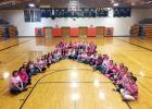 ​Some of the women – faculty and students – of Philip High School created a human pink ribbon (cancer awareness) in recognition of Dig Pink Week.