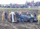 Safety first. Members of the Philip Volunteer Fire Department quickly checked the driver, then were wary of sparks and the car falling the wrong way as they got these two cars down. Then, the demolition derby heat roared on.