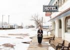 Laurie Cox stands in front of the Stroppel Hotel in Midland, South Dakota. Cox bought the two-story hotel in part to house the men and women who were hired to work on the Keystone XL pipeline. Todd Ellingson