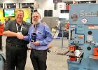 Adam Mattes, the owner of Sterling Machinery, left, presented the company’s Top Quality Award to Scotchman Industry, Inc., Philip. Accepting the prestigious recognition was Jerry Kroetch, president of Scotchman.
