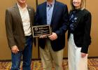 Shane Penfield (center), the 2023 Prosecutor of the Year, is pictured with South Dakota Attorney General Marty Jackley and Alexis Tracy, current Clay County State’s Attorney and State’s Attorneys Association board president.